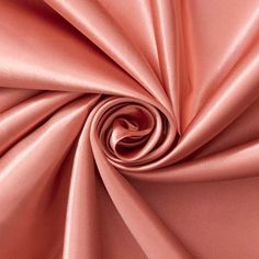 a close up view of a pink satin fabric