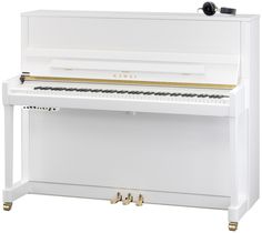 a white piano with gold accents on the top and bottom part, sitting upright in front of a white background