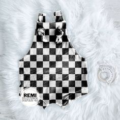 This checkered black and white print is available in several different styles. Our overalls being our newest! Choose your size and style of clothing. Create sets, or even snag enough for the whole team! Available in most styles up to 10Y. Material: DBP; 96% Polyester|4% Lycra; Biker Shorts will be in wide ribbed knit fabric.  Care:  To extend the wear of your item, it is recommended to use a gentle wash and tumble dry. If possible, hang-drying is always best for handmade items! Turn Around Time (TAT) and Shipping: Current TAT is 1-2 weeks. This allows for fabric to be ordered, washed, cut, sewed, inspected, and sewed. If fabric is already on hand your order will be a 1 week TAT.  A tracking number is always attached to our orders after it has been packaged and shipped. Please allow 24 hour Checkered Smash Cake, Checkered Theme Nursery, Checkered Nursery Baby Boy, Checkered Overalls, Checkered Bodysuit, Checkered Black And White, Kids Overalls, Black And White Shorts, Black And White Print