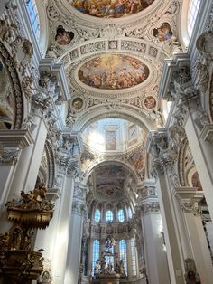 the interior of a church with painted ceilings