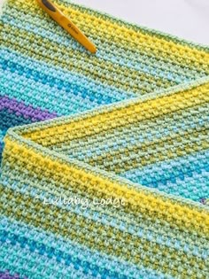 two crocheted placemats sitting on top of each other