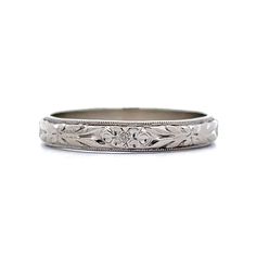 an antique style wedding ring with filigrees