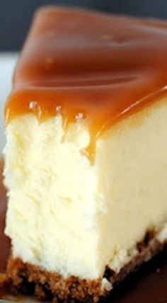 a piece of cheesecake with chocolate sauce on top