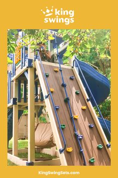 a child's play area with swings and slides for kids to climb up on