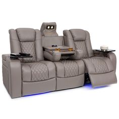 the reclining sofa has two chairs and a table on it's back end