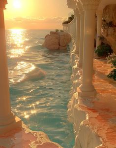 the sun is setting over the ocean with columns