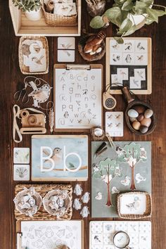 the table is covered with many different items including cards, magnets and other things