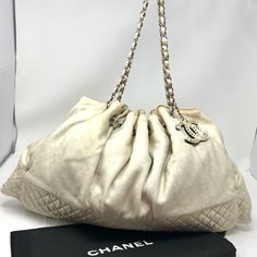 Chanel Xl Melrose Cabas Light Cream Colored Quilted Jersey 12 Series Tote. Chic Tote From 2008 Is Crafted Of Soft Jersey W/ Subtle Metallic Sheen & A Diamond Quilted Bottom. The Bag Features Dual Cinch Style Silver Chain Link Shoulder Straps Threaded W/ Fabric & A Reversible Oversized Chanel Cc Logo Bag Charm. Spacious Tan Satin Interior W/ 2 Patch Pockets. Guc W/ Slight Exterior Darkening Near Top; The Fabric Has Partially Come Away From A Few Cinch Loops; A Few Small Marks To Interior Satin. Chanel Patchwork Bag, Chanel Cerf Tote, Cream Chanel Bag, Chanel Medallion Tote, Chanel Grand Shopping Tote, Chanel Canvas, Chanel Large Shopping Bag, Chanel Tote Bag, Red Tote Bag