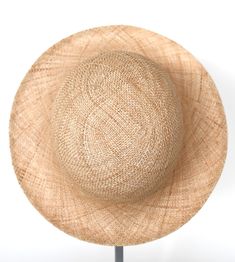 "\"Pina\" is a light summer sun hat with a wide flared brim. The shapely curve of the brim ensures a perfect fit and underlines a clear, feminine look. The material \"Bao\" made of the undyed fibres of the baobab tree is pleasantly permeable to air and ensures maximum wearing comfort. Available in sizes 55 cm - 60 cm. Colour \"nature\" Hat of \"Bao\" - Monkey bread tree Grosgrain ribbon (inside) made of 66% cotton and 34% polyamide Handmade Individualization options Other colours or sizes on req Elegant Toquilla Straw Panama Hat, Elegant Brimmed Straw Sun Hat, Elegant Straw Sun Hat, Adjustable Cloche Sun Hat For Spring, Adjustable Summer Cloche Hat, Beige Toquilla Straw Bucket Hat With Flat Brim, Elegant Natural Boater Hat For Garden Party, Elegant Natural Brimmed Panama Hat, Elegant Natural Panama Hat For Spring