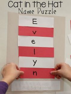 the cat in the hat name puzzle is made with red paper and cut out letters