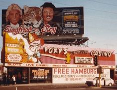 an old photo of the outside of a casino with signs and advertisements on it's sides