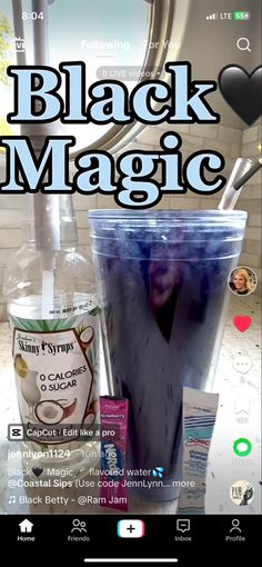 the black magic drink is next to an empty cup