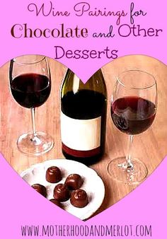 two glasses of wine and some chocolates on a table