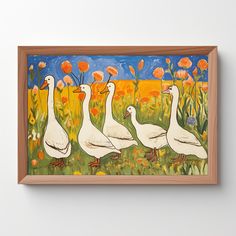 three ducks are walking in the grass near flowers