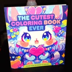 the cutest coloring book ever is on display in front of a black table top