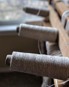 several spools of twine sitting on top of a table