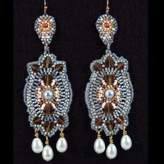 These Vintage Style Dangle Earrings Are Intricately Hand Beaded In Shades Of Pale Icy Blue, Gold And White, Accented With Taupe Crystals And Glass Pearls. Sparkling Glass Beads And (Popular Brand Name) Crystals. Perfect For An Elegant Formal Occasion Or A More Relaxed Setting. Details Handmade Item Length: 4 Inches Width: 1 Inch Materials: Glass, Gold, Crystal, Glass Pearls Closure: Ear Wire Style: Victorian, Vintage, Miguel Ases, Boho, Gypsy Blue Beaded Earrings, Wearable Art Clothing, Beaded Art, Victorian Vintage, Artisan Earrings, Couture Jewelry, Icy Blue, Gold Crystal, Brick Stitch