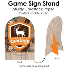 the game sign stand is made out of wood and has an arrow pointing to it