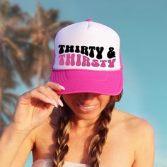 Whether you're lounging poolside, hitting the beach, or simply sipping on your favorite cocktail, these "Thirty & Thirtsy" trucker hats add an extra layer of flair to your beach birthday festivities. They're the perfect accessory for capturing unforgettable memories and creating Instagram-worthy moments! ♥ Product details: .: Sold separately .: Material: 100% polyester foam front with 100% nylon mesh weave back .: One size fits most (22.8"/58cm) .: Adjustable snap closure ♥ Shipping: A tracking Trendy Summer Birthday Hat, Pink Novelty Trucker Hat For Beach, Pink Novelty Trucker Hat For The Beach, Fun Summer Birthday Hat, Novelty Pink Trucker Hat For Summer, Pink Novelty Trucker Hat For Summer, Novelty Summer Trucker Hat For Beach, Novelty Summer Trucker Hat For The Beach, Fun Summer Party Trucker Hat