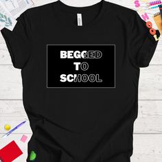 Begged To School. Get ready to head back to school in style with this versatile t-shirt, perfect for students and teachers alike! Whether you're hitting the books or leading the class, this comfortable and trendy shirt is a must-have addition to your back-to-school wardrobe. Made with high-quality materials and featuring a unique design, this t-shirt is sure to make a statement wherever you go. Treat yourself or surprise a special student or teacher in your life with this perfect back-to-school essential. This classic unisex jersey short sleeve tee fits like a well-loved favorite. Soft cotton and quality print make users fall in love with it over and over again. These t-shirts have-ribbed knit collars to bolster shaping. The shoulders are tapered for a better fit over time. Dual side seams Black T-shirt For Back To School, School Spirit T-shirt For College And Back To School, Back To School Spirit T-shirt For College, Black Text Print T-shirt For School, Black School Spirit T-shirt With Slogan, Back To School Black Graphic T-shirt, Black T-shirt For Back To School Events, Black Graphic Print T-shirt For Back To School, Black Text Print Top For Back To School