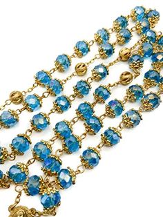 Light Blue Crystal Beads Rosary Handcrafted St. Benedict Rosary with blue crystallized glass beads with Miraculous medal and silver 1.6" Cross. Strong and elegant Rosary made of zinc alloy plated in gold for enhanced durability and corrosion resistance. ensures sturdiness while adding a touch of elegance to the design. Five decades rosary connected to devout 59 beads perfectly designed to hold on during daily usage. wearable for most people, easy to carry in your pocket, bag, or keep in your car Gold Crystal Beads For Gifts, Blue Beaded Metal Jewelry, Blue Crystal Round Bead Jewelry, Blue Beaded Chain Jewelry, Blue Crystal Round Beads Jewelry, Nickel-free Blue Round Bead Jewelry, Blue Metal Jewelry With Faceted Beads, Blue Beaded Round Jewelry, Blue Crystal Round Beaded Jewelry