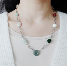 Unleash your urban mystique with the Metropolis Hermit jewelry collection. Featuring a captivating blend of natural gemstones and bold chains, each piece embodies the spirit of a modern-day hermit. Discover the allure of solitude and express your individuality with these edgy and sophisticated designs. ❀ Natural Jade, Jadeite, and Carved Cinnabar Auspicious Clouds❀ Natural Baroque Pearls❀ Natural White Agate Lotus Flower❀ Natural Jadeite Donut❀ Silver Plated Brass Chain and Sterling Silver Clasp