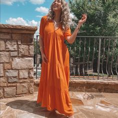 Add Some Color To Your Vacay Wardrobe With This Oversized Italian Made Maxi Dress From Dixie Brand. Featuring An Orange Material, Teared Skirt And Oversized Fit. Just Add Some Gold Jewlery, Strappy Sandals, And A Cute Tote For The Ultimate Summer Look! Recommended To Size Down. Runs On The Larger Side. V-neck Maxi Dress For Daytime, Relaxed Fit V-neck Maxi Dress For Brunch, V-neck Maxi Dress For Brunch, Casual Orange Flowy Maxi Dress, Orange Tiered Maxi Dress For Beach, Orange Short Sleeve Maxi Dress For Brunch, Casual Orange Maxi Dress For Brunch, Orange V-neck Maxi Dress For Daywear, Teared Skirt