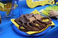 a blue table topped with lots of chocolate