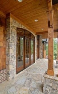 an image of a porch with stone and wood