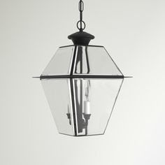 a light hanging from the ceiling in a room