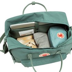 Introducing the Kånken Weekender from Fjällräven, a compact yet versatile bag designed for spontaneous getaways and weekend adventures. With its sleek Scandinavian design and durable construction, this weekend bag is the perfect companion for your short trips and urban escapades.Crafted from Fjällräven's signature Vinylon F fabric, the Kånken Weekender offers exceptional durability and water resistance to keep your belongings safe and dry in various weather conditions. Its compact size makes it Raven Color, Fjällräven Kånken, What In My Bag, Belem, Travel Collection, Kanken Backpack, Fjallraven Kanken, Weekender Bag, Duffel Bag