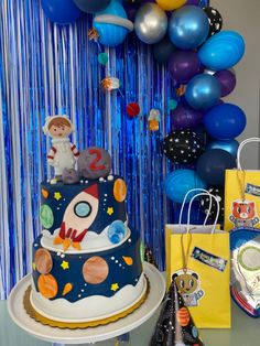 a space themed birthday party with balloons and decorations