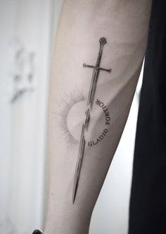 A sword tattoo is one of the most iconic designs. But only a few people know the true meaning behind it. Dive into our research to become a real sword tattoo lord. Vertical Tattoo, Wolf Tattoo Sleeve, Simple Tattoos For Guys, Ornamental Tattoo, Greek Tattoos, Small Tattoos For Guys, Badass Tattoos, Hand Tattoos For Guys