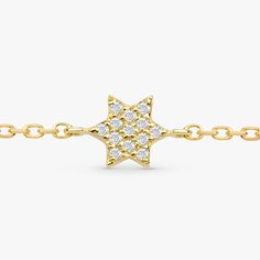 Shlomit This mini diamond Jewish star is perfectly delicate and dainty! It is a beautiful piece for any age and extra special as a Bat Mitzvah gift. This 14k solid gold bracelet is available in Yellow Gold, White Gold, and Rose Gold. - Handmade- Solid Gold- Natural Diamonds- Star Size: 9 mm- Total Diamond Carat Weight: .04 ctw All pieces come beautifully boxed in suede pouches you can always use (which really comes in handy when traveling!) Dazzling Pave Setting Bracelet Gift, 14k Gold Bracelets With Pave Setting For Gift, 14k Gold Bracelets With Pave Setting As Gift, 14k Gold Bracelet With Pave Setting As Gift, Pave Setting Bracelets As Gift, Jewish Star, Bat Mitzvah Gifts, Solid Gold Bracelet, Diamond Star