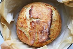 a loaf of bread sitting inside of a bowl