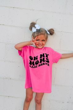 "Introducing our kids (or adult) Comfort Colors® T-Shirt, a stylish piece  that shows their unique personality. With its unique design and customizability, this shirt is perfect for your little girl or boy. The front of the shirt features an eye-catching print that boldly states \"On my moms last nerve\".  Our youth Comfort Colors® T-Shirt is not only fashionable but also comfortable to wear. Made with high-quality materials, it provides a soft and relaxed fit, perfect for everyday wear and play. Please note all sizes except 2T are Comfort Colors brand." Trendy Tshirts, Kids Tops, Funny Shirts, Tshirt Colors, Shirts For Girls, Comfort Colors, Everyday Wear, Kids Outfits, Unique Designs