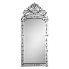 a large mirror with an ornate design on the top and bottom edge, in silver