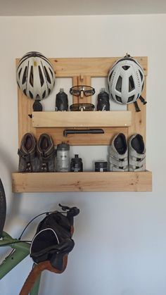 there is a bicycle and helmet rack on the wall