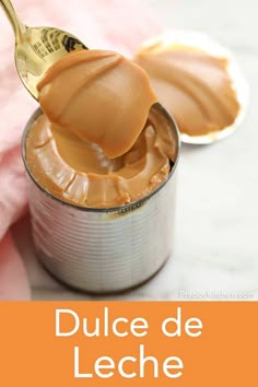 a spoon full of peanut butter with the words dulce de leche on it