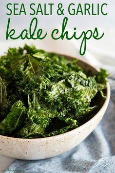 sea salt and garlic kale chips in a white bowl on a blue table cloth