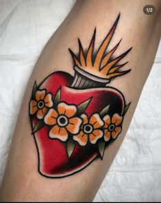 a heart with flowers on it and an arrow in the shape of a tattoo design