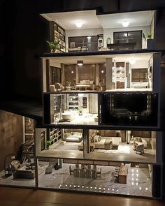 the inside of a doll house with furniture and lights in it's display case