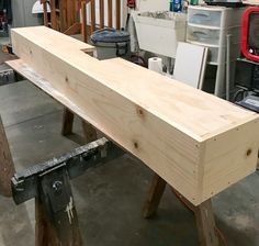 a wooden bench being built in a shop