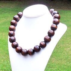 Chunky Wood Necklace Large Wood Necklace Big Wood Bead Necklace Bohemian Necklace Boho Necklace 25mm Round Dark Brown Wood Bead Necklace This modern beauty was hand beaded using large and chunky 25mm round deep brown wooden beads. The necklace measures your choice of 22, 25, 30, or 38 inches long and is securely fastened with a silver clasp. The end result is a chic bohemian piece that fits in perfectly with today's fashion trends! Length can be adjusted if needed - just ask! Check out more fabu Wooden Beads Necklaces For Jewelry Making, Round Wooden Beads Necklaces For Jewelry Making, Bohemian Necklaces With 8mm Beads, Bohemian Necklace With 8mm Round Beads, Brown Wooden Beads Round Jewelry, Wooden Beads Round Necklace As Gift, Brown Wooden Beads Jewelry, Wooden Beads Necklace Gift, Brown Round Wooden Beads Jewelry