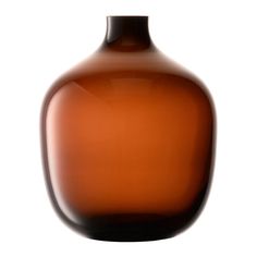 a brown glass vase sitting on top of a table