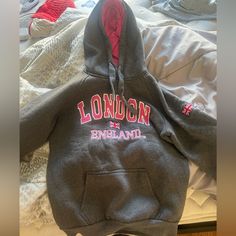 Brand New!! London England Gray Hoodie. Size Medium. “London England” In Pink And So Is Inside Of Hood. Winter Varsity Pink Sweatshirt, Pink Varsity Sweatshirt For Winter, Gray Hoodie, New London, Colorful Hoodies, Grey Hoodie, London England, England, Womens Sizes