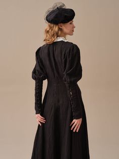 Elegant Linen Dress With Gathered Sleeves, Elegant Linen Puff Sleeve Dress, Elegant Black Linen Dress For Daywear, Black Fitted Linen Midi Dress, Fitted Black Linen Midi Dress, Elegant Black Midi Linen Dress, Elegant Black Fitted Linen Dress, Elegant Fitted Black Linen Dress, Black Linen Long Sleeve Dress