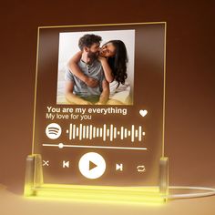 an illuminated photo frame with the words you are my everything and a music player on it