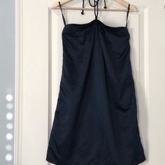 New Navy Satin Halter Dress From The Gap. Features Pleats On Front Neckline And A Braided Halter Strap. Photo Was Taken With Bra Straps Showing On Hanger. Back Has Elastic To Help Hold Dress Up. Unlined. Sfpf Home. Gap Sundress For Summer, Gap Summer Mini Dress, Navy Knee-length Mini Dress For Summer, Chic Summer Midi Dress By Gap, Navy Mini Dress For Summer, Chic Summer Gap Midi Dress, Sleeveless Mini Dress By Gap, Gap Spring Mini Dresses, Gap Summer Beach Dresses