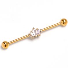 an image of a gold barbell ring with crystal stones on the top and bottom